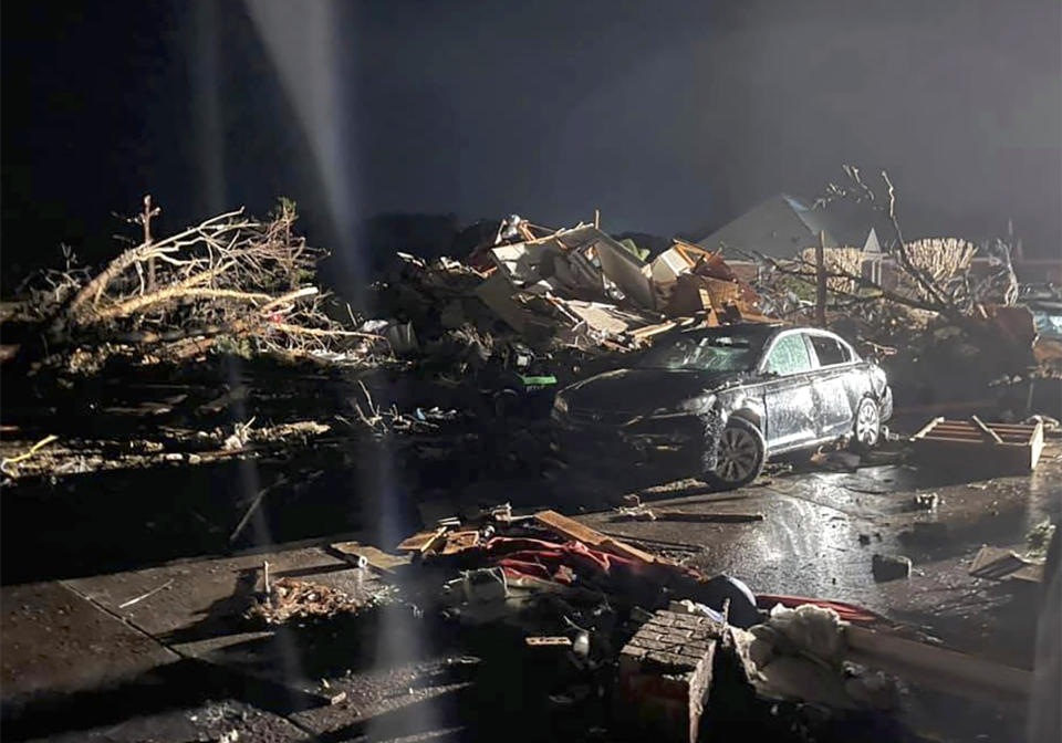 A damaged vehicle is seen among debris after a deadly tornado tore through Brunswick County, N.C., Tuesday, Feb. 16, 2021. North Carolina authorities say multiple people are dead and others were injured after a tornado ripped through Brunswick County, leaving a trail of heavy destruction. (Emily Flax/Brunswick County Sheriff’s Office via AP)