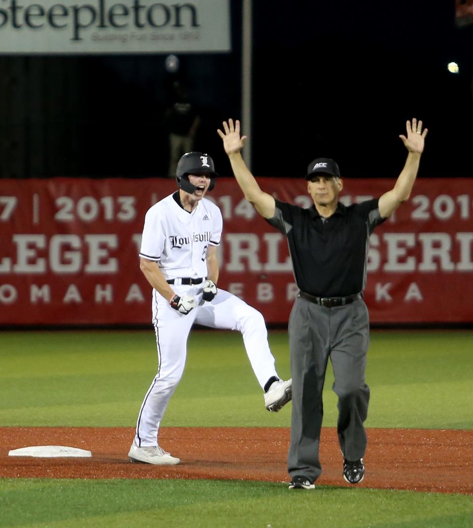 Louisville’s Isaac Humphrey celebrates getting a double and knocking a run in against Vanderbilt on May 9, 2023.