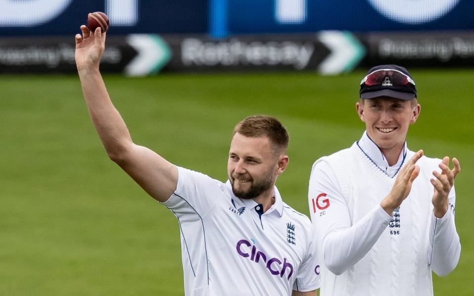 Gus Atkinson celebrates taking his fifth wicket