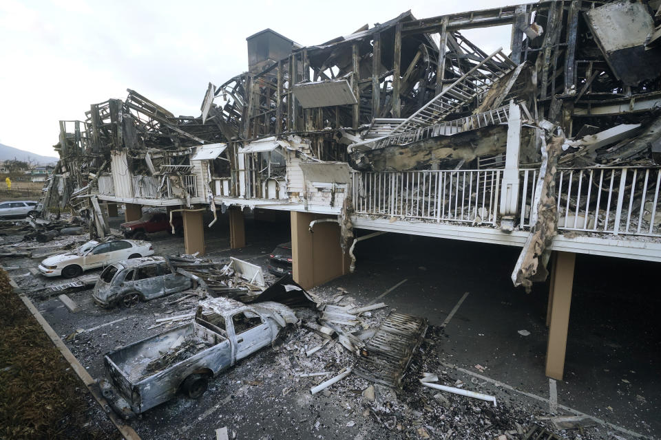 Wildfire wreckage is shown Friday, Aug. 11, 2023, in Lahaina, Hawaii. Hawaii emergency management records show no indication that warning sirens sounded before people ran for their lives from wildfires on Maui that wiped out a historic town. (AP Photo/Rick Bowmer)