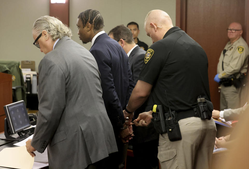 Former Las Vegas Raiders NFL football player Henry Ruggs III is taken into custody following his sentencing hearing at the Regional Justice Center, Wednesday, Aug. 9, 2023, in Las Vegas. Ruggs pleaded guilty May to felony DUI causing death and misdemeanor vehicular manslaughter. (K.M. Cannon/Las Vegas Review-Journal via AP)