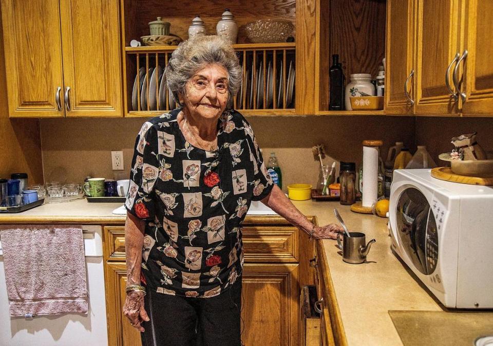 Ela Avila poses in her kitchen as she makes coffee on Tuesday, April 11, 2023. She’s under the authority of a court-appointed guardian, but said she wants the arrangement to end.