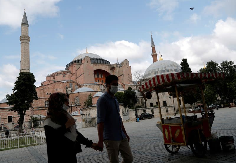 FILE PHOTO: People walk past Hagia Sophia, or Ayasofya, in Istanbul