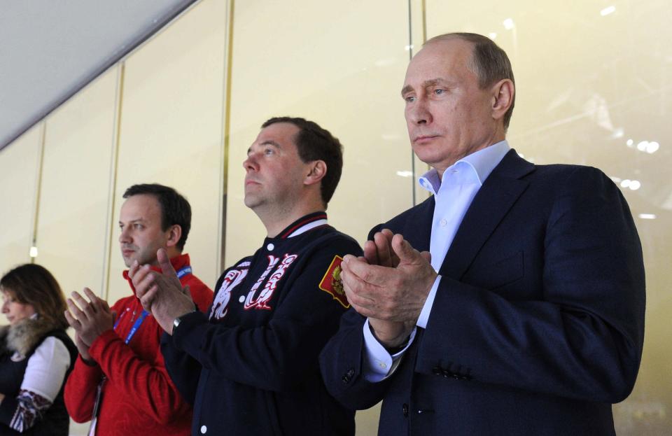 FIDE President Arkady Dvorkovich (far left) has ties to the Kremlin as a former deputy prime minister under former Russian President Dmitry Medvedev (center) and current President Vladimir Putin.