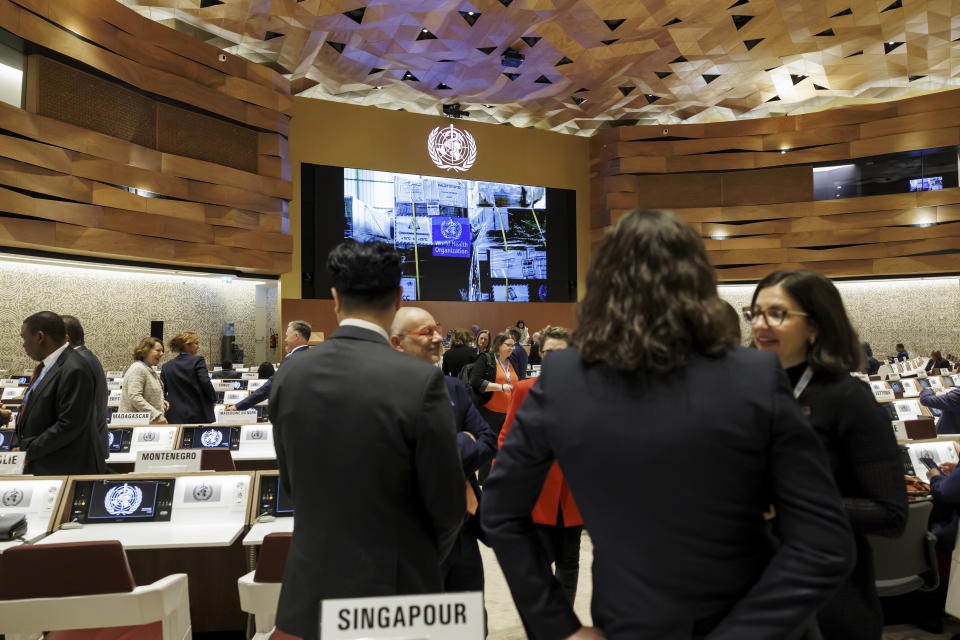 Delegates arrive for the opening of the 77th World Health Assembly (WHA77) at the European headquarters of the United Nations in Geneva, Switzerland, Monday, May 27, 2024. The World Health Organization is kicking off its annual meeting on Monday and government ministers and other top envoys are looking to reinforce global preparedness for, and responses to the next pandemic in the devastating and deadly wake of COVID-19. (Salvatore Di Nolfi/Keystone via AP)