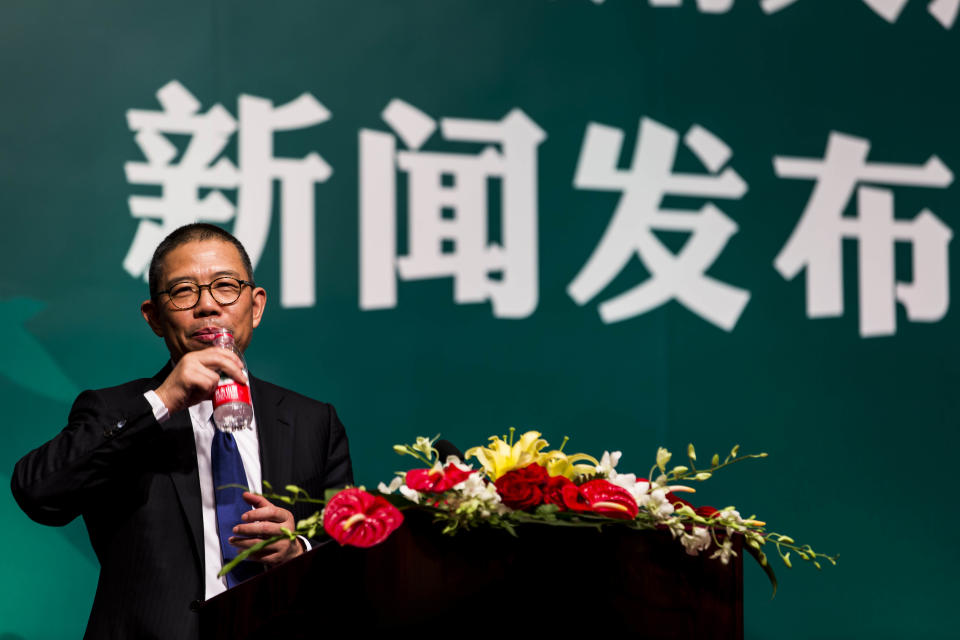 --FILE--Zhong Shanshan, Chairman of Nongfu Spring Co., Ltd., delivers a speech at a press conference in Beijing, China, May 6, 2013. Shares of Chinese bottled water giant Nongfu Spring surged more than 85\% in their debut on the Hong Kong stock market. The stock opened at 39.80 Hong Kong dollars per share ($5.14), more than 85\% higher than its initial public offering price of 21.50 Hong Kong dollars ($2.77).