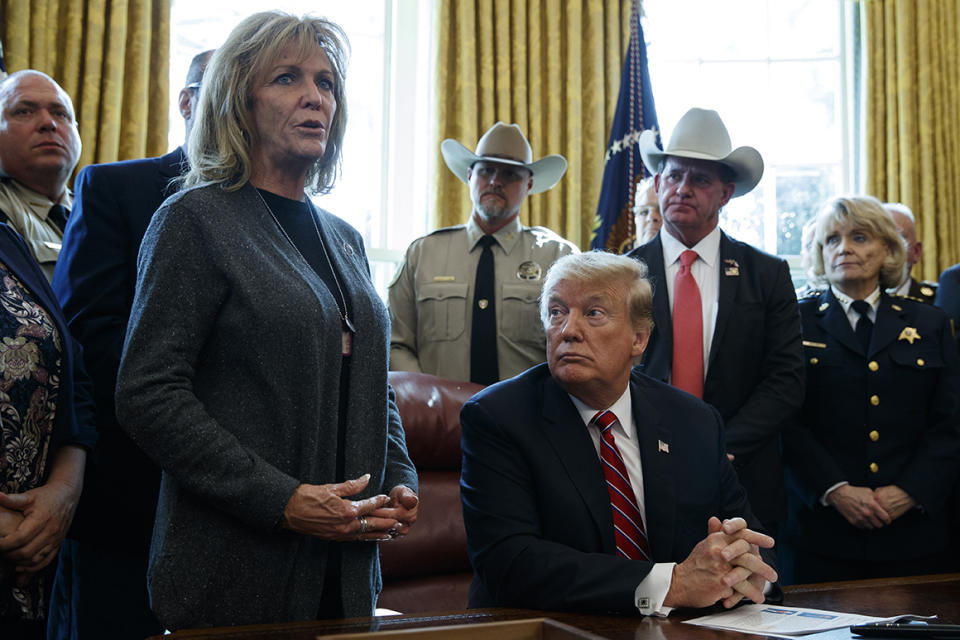 President Donald Trump listens as Mary Ann Mendoza, who lost her son when he was killed by a drunk driver that was an undocumented immigrant, speaks in the Oval Office of the White House in March 2019.