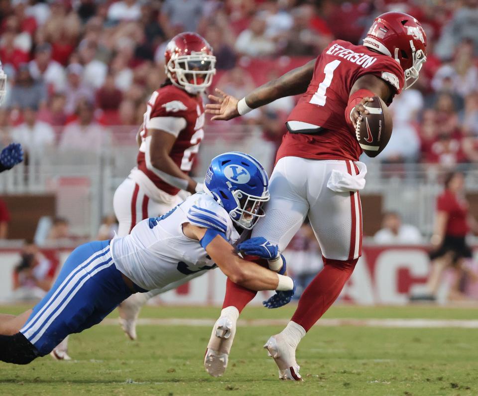 Brigham Young Cougars linebacker Max Tooley (31) sacks Arkansas Razorbacks quarterback KJ Jefferson (1) at Razorback Stadium in Fayetteville on Saturday, Sept. 16, 2023. | Jeffrey D. Allred, Deseret News