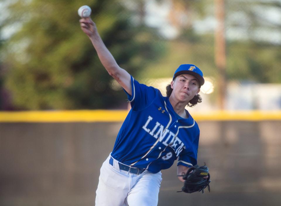 Linden's Eric Alvarez delivers a pitch during a varsity baseball game at Stagg in Stockton on Thursday, Apr. 27, 2023.