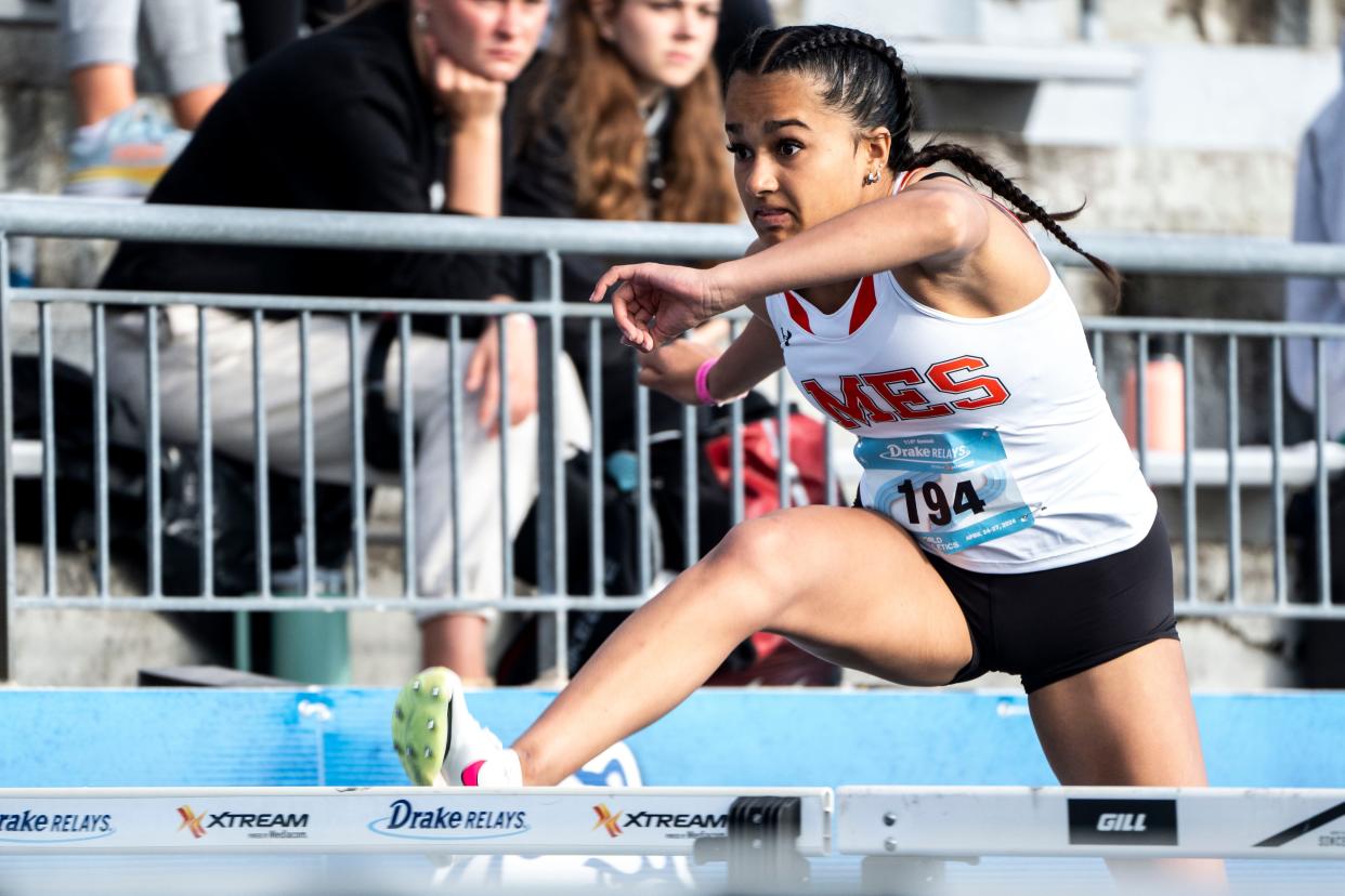 Ames' Elia Varghese competes in the 100 meter shuttle hurdle relay preliminary races during the Drake Relays at Drake Stadium on Saturday, April 27, 2024, in Des Moines.