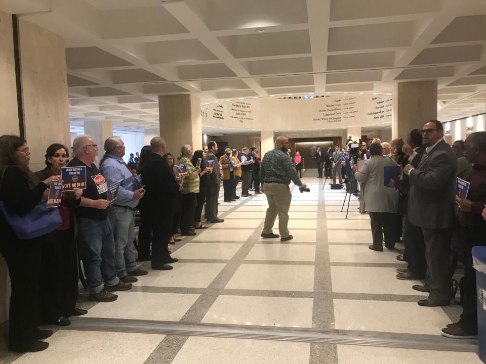 More than 100 union members formed a gauntlet to the doors of the House chambers to protest what they call a union busting bill. HB 1 would require public sector union members to reauthorize their membership on an annual basis