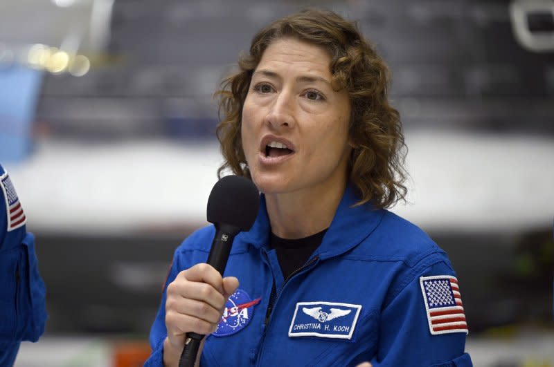 NASA's Artemis II mission specialist Christina Koch replies to questions from the media while viewing the Orion spacecraft Tuesday at Kennedy Space Center in Florida as it is being prepared for her mission planned for late 2024. Photo by Joe Marino/UPI
