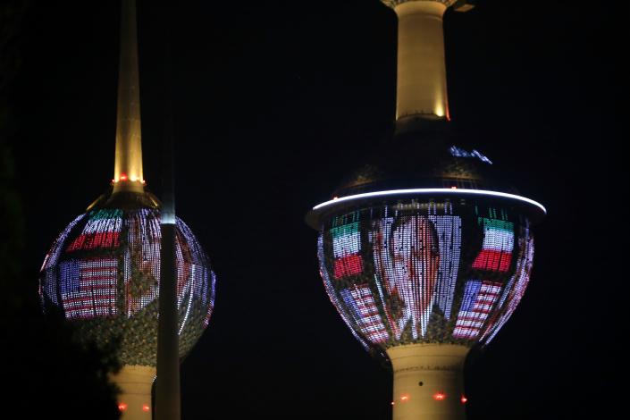 Kuwait’s Towers in Kuwait City are illuminated in the colors of the American flag and a portrait of former President George H.W. Bush on Dec. 1, in tribute to the late U.S. leader. (Photo: Yasser Al-Zayyat/AFP/Getty Images)