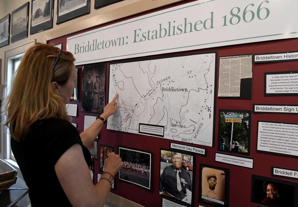 Melissa Reid shows the location of Briddletown on Monday, May 16, 2022, in an exhibit at the Calvin B. Taylor House in Berlin, Maryland.
