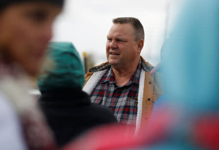 U.S. Senator Jon Tester meets with striking members of the International Boilermakers Union Local D239 and their supporters outside Imerys Talc America Inc. in Three Forks, Montana, U.S., October 13, 2018. REUTERS/Jim Urquhart