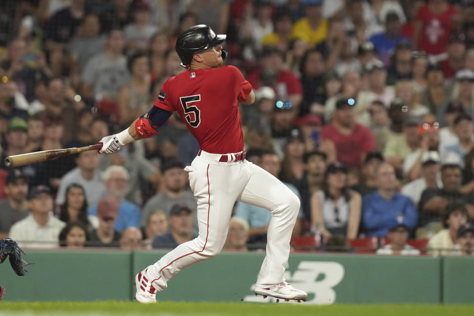 Boston Red Sox's Enrique Hernandez follows though on his swing after hitting a two-run single in the seventh inning of a baseball game against the Texas Rangers, Thursday, July 6, 2023, in Boston. (AP Photo/Steven Senne)
