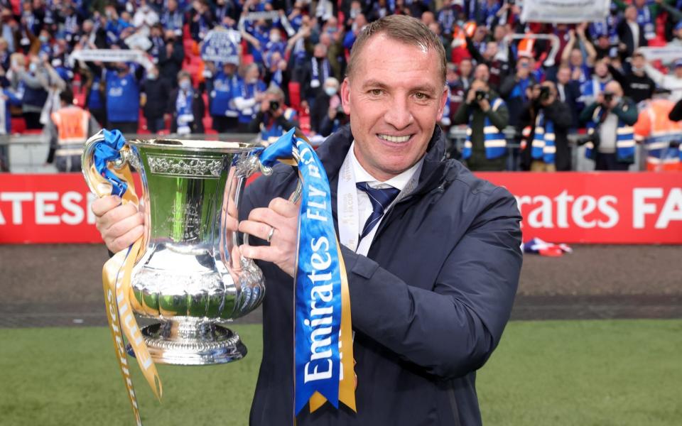 Leicester City Manager Brendan Rodgers celebrates with The FA Cup trophy after winning The Emirates FA Cup Final match between Chelsea and Leicester City at Wembley Stadium - Getty Images/Plumb Images