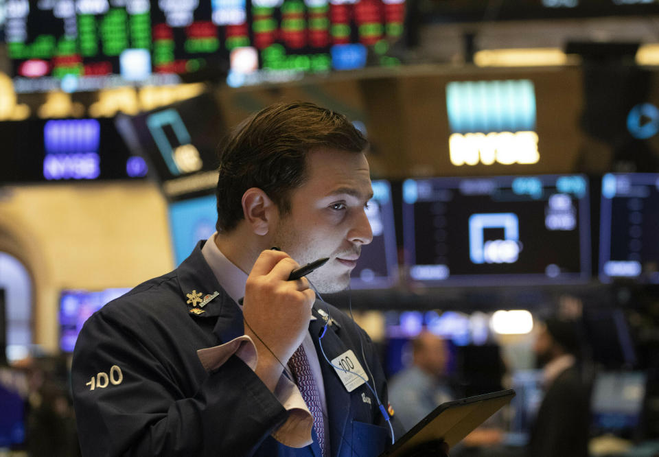 FILE - In this July 5, 2019, file photo trader Benjamin Tuchman works at the New York Stock Exchange in New York. The U.S. stock market opens at 9:30 a.m. EDT on Thursday, July 11. (AP Photo/Mark Lennihan, File)