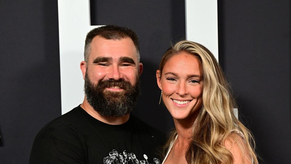 kylie and jason kelce posing on a red carpet