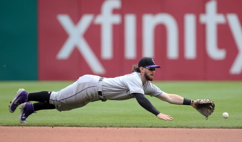 FILE PHOTO: Colorado Rockies second baseman Brendan Rodgers reaches for a ball hit for a single by Pittsburgh Pirates first baseman Josh Bell during their Major League Baseball game at PNC Park, Pennsylvania.