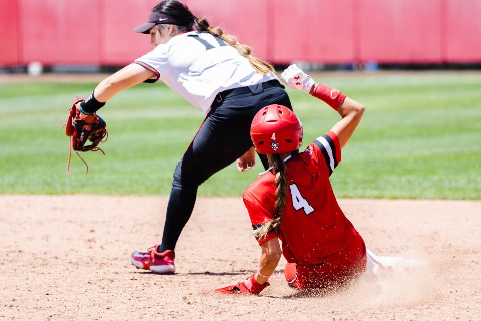 Utah outfielder Shelbi Ortiz (4) slides into second base during the third game of the NCAA softball Super Regional between Utah and San Diego State at Dumke Family Softball Stadium in Salt Lake City on Sunday, May 28, 2023. | Ryan Sun, Deseret News