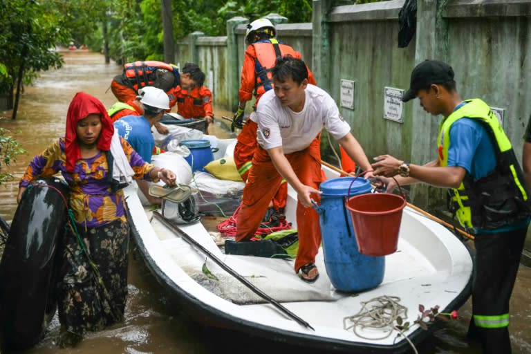 Rescue workers race to evacuate residents affected by severe flooding in Myanmar (Sai Aung MAIN)