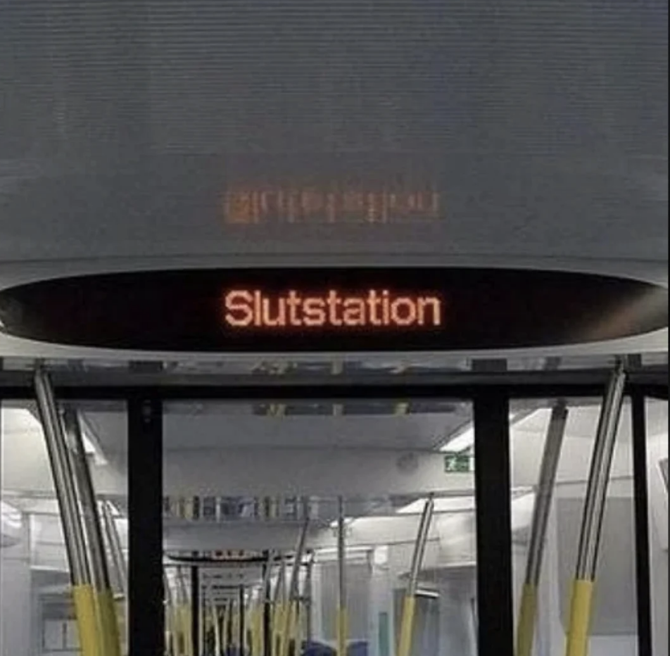 Electronic sign displaying "Slutstation", meaning end station in Swedish, at a train or bus station