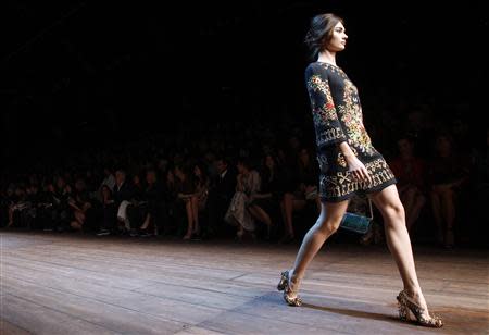 A model presents a creation from the Dolce&Gabbana Autumn/Winter 2014 collection during Milan Fashion Week February 23, 2014. REUTERS/Alessandro Garofalo