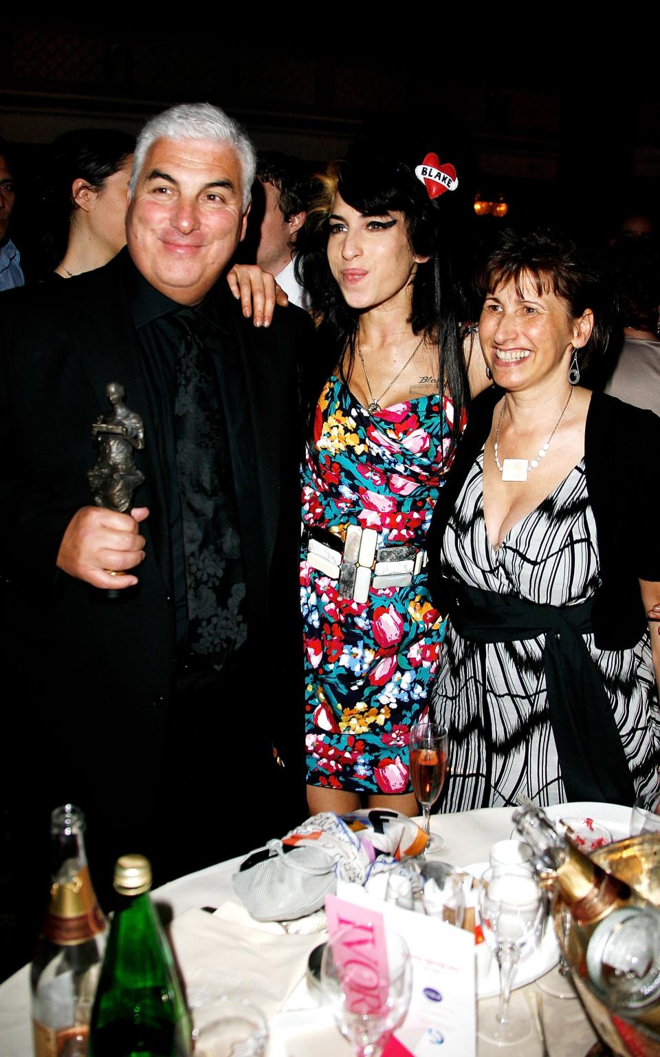 Amy and her parents at the Ivor Novello awards - Getty Images