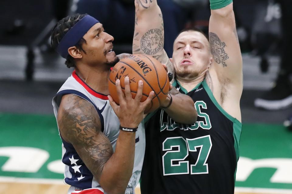 Washington Wizards' Bradley Beal goes up to shoot against Boston Celtics' Daniel Theis (27) during the first half of an NBA basketball game, Sunday, Feb. 28, 2021, in Boston. (AP Photo/Michael Dwyer)