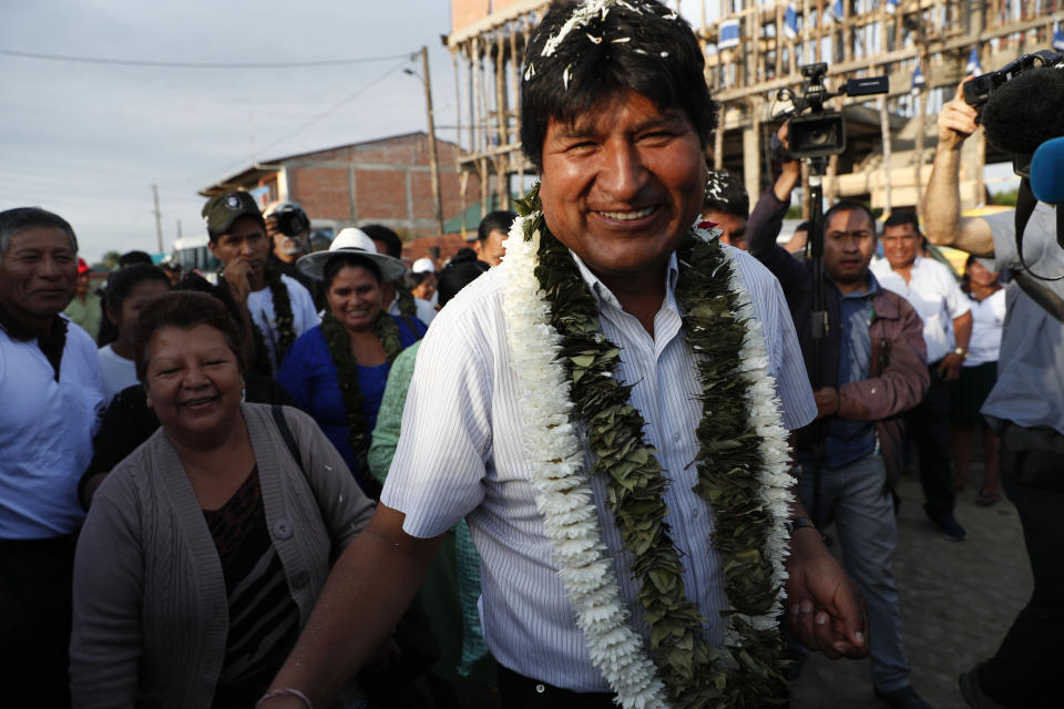 Bolivia's President Evo Morales greets followers before casting his vote in Villa 14 de Septiembre, in the Chapare region, Bolivia, Sunday, Oct. 20, 2019. Bolivians are voting in general elections Sunday where Morales is Presidential candidate for a fourth term.(AP Photo/Juan Karita)