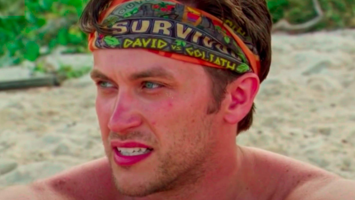  Nick Wilson sits on the beach during an episode of Survivor. 