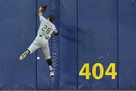Chicago White Sox center fielder Tommy Pham leaps but can't make the catch on a triple by Tampa Bay Rays' Amed Rosario during the third inning of a baseball game Monday, May 6, 2024, in St. Petersburg, Fla. (AP Photo/Chris O'Meara)