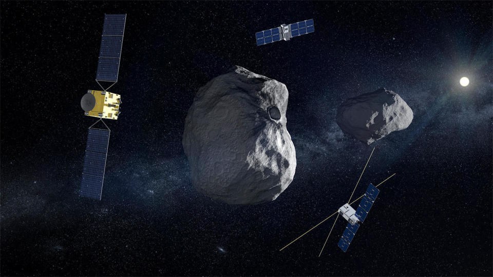 Una impresión artística de la sonda Hera de la Agencia Espacial Europea (izquierda) y dos pequeños subsatélites que orbitarán el asteroide Didymos y su pequeña luna Dimorphos para aprender más sobre cómo el impacto de alta velocidad de la sonda DART de la NASA en septiembre de 2022 alteró la luna. órbita y estructura. Ambas misiones son parte de un esfuerzo para determinar cómo desviar de forma segura un asteroide en curso de colisión con la Tierra. / Crédito: ESA