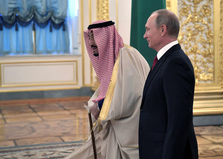 Russian President Vladimir Putin (R) and Saudi Arabia's King Salman walk before their meeting in the Kremlin in Moscow, Russia October 5, 2017. Sputnik/Alexei Nikolsky/Kremlin via REUTERS