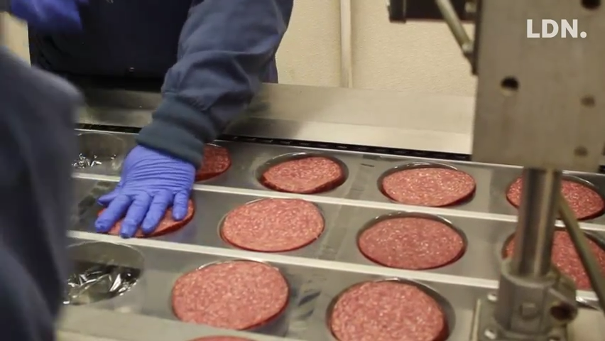 Plant manager at Seltzer's Smokehouse Meats explains the process of making the local delicacy, Lebanon Bologna.