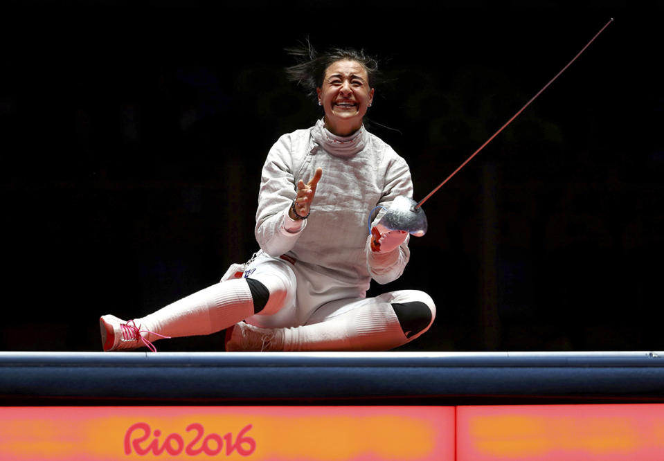 <p>Yana Egorian of Russia celebrates winning gold in the women’s sabre individual fencing final on August 8, 2016. (REUTERS/Lucy Nicholson) </p>