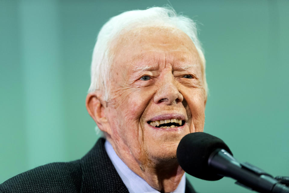 FILE - In this Sept. 18, 2019 file photo, former President Jimmy Carter listens to a question submitted by a student during an annual Carter Town Hall held at Emory University in Atlanta. Carter is back at church teaching Sunday school less than two weeks after breaking his pelvis in a fall. The 95-year-old Democrat used a walker to slowly enter the crowded sanctuary at Maranatha Baptist Church in the southwest Georgia town of Plains on Sunday, Nov. 3. (AP Photo/John Amis, File)