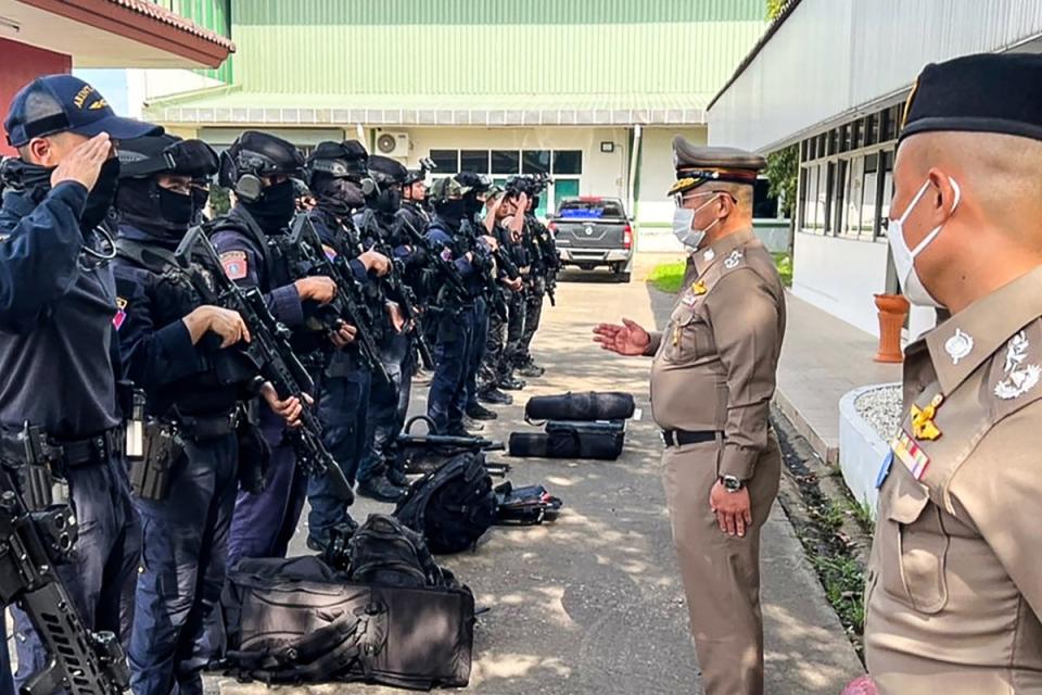 Police chief Damrongsak Kittiprapat speaks with a police operation team (Royal Thai Police/AFP via Getty)