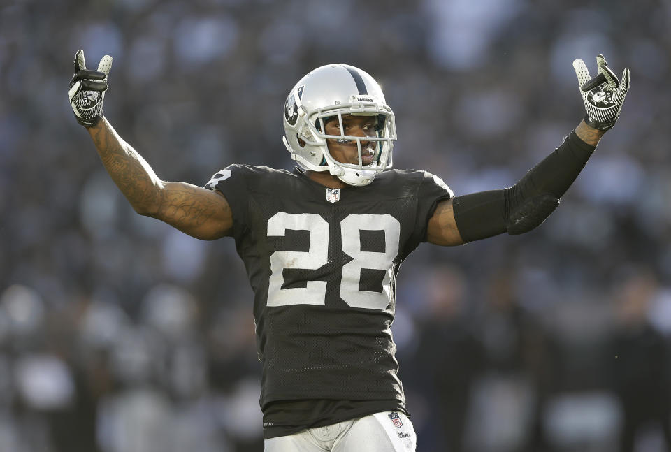 FILE - In this Dec. 15, 2013 file photo, Oakland Raiders defensive back Phillip Adams (28) gestures while playing against the Kansas City Chiefs during the second half of an NFL football game in Oakland, Calif. A source briefed on a mass killing in South Carolina says the gunman who killed multiple people, including a prominent doctor, was the former NFL pro. The source said that Adams shot himself to death early Thursday, April 8, 2021. (AP Photo/Marcio Jose Sanchez, File)