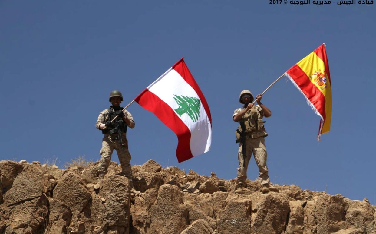 Lebanese soldiers wave Lebanese and Spanish flags to show their solidarity with Spain after the Thursday attacks in Barcelona and Cambrils - Lebanese Army Website