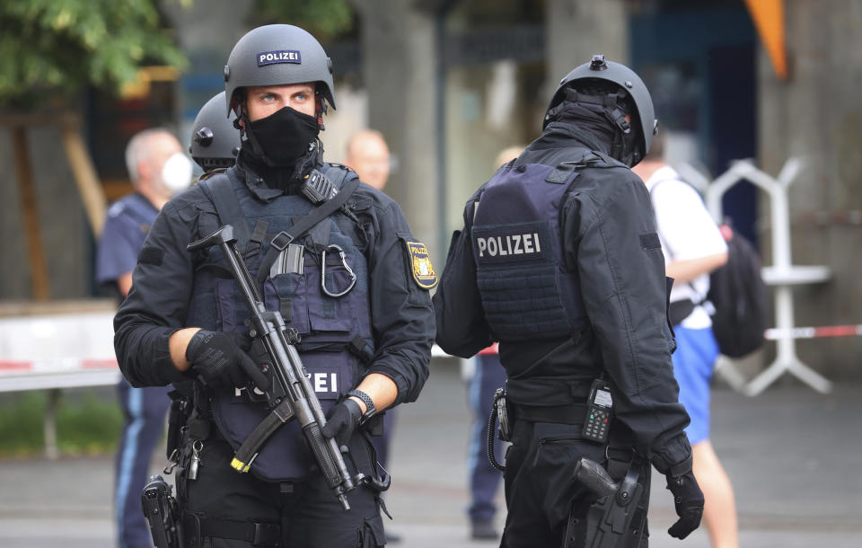 Police attend the scene of an incident in Wuerzburg, Germany, Friday June 25, 2021. German police say several people have been killed and others injured in a knife attack in the southern city of Wuerzburg on Friday. (Karl-Josef Hildenbrand/dpa via AP)