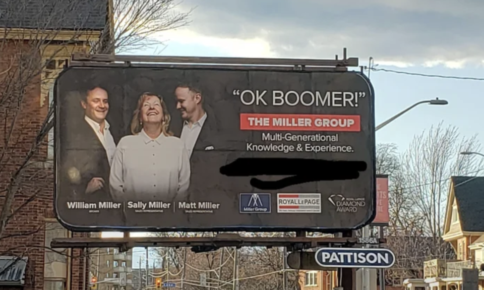 realtor billboard says "OK BOOMER!