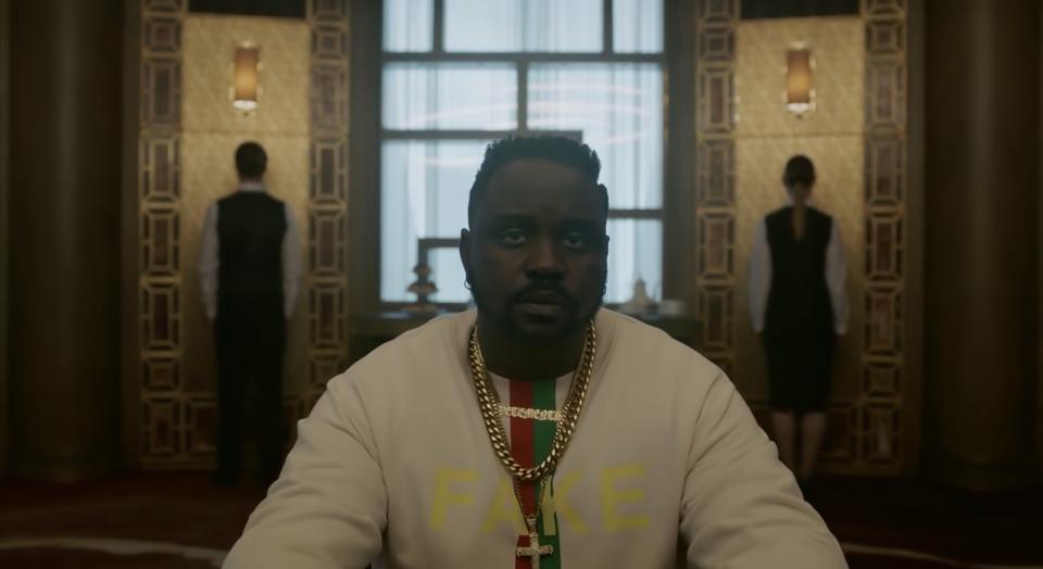 Brian Tyree Henry as Paper Boi, sitting in an upscale room in Paris