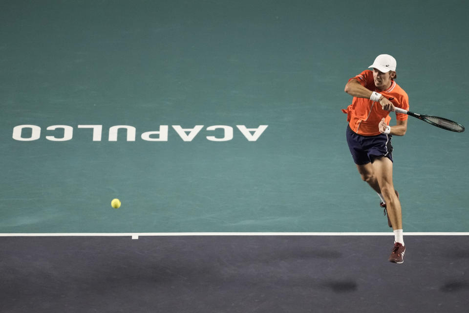 Australia's Alex de Minaur follows through on a return to Stefanos Tsitsipas, of Greece, during a Mexican Open tennis tournament match in Acapulco, Mexico, Thursday, Feb. 29, 2024. (AP Photo/Eduardo Verdugo)