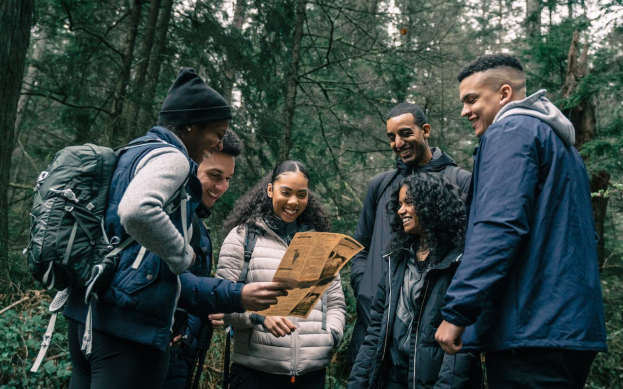 Multivultural group of friends in the woods - Most Diverse Cities