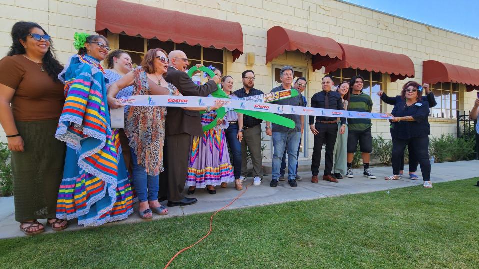 Founding Artistic Director David Catanzarite and Founding Board President Karen Lin are joined by other members of the Green Room Theatre Company family and supporters to celebrate the office ribbon cutting on May 25, 2023 in Coachella, Calif.