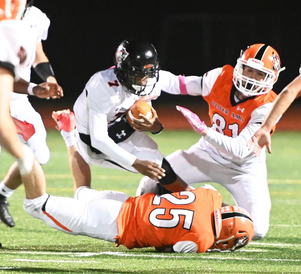 Stoughton quarterback Jarred Daughtry carries the football during a game against Oliver Ames on Friday, Oct. 1, 2021.