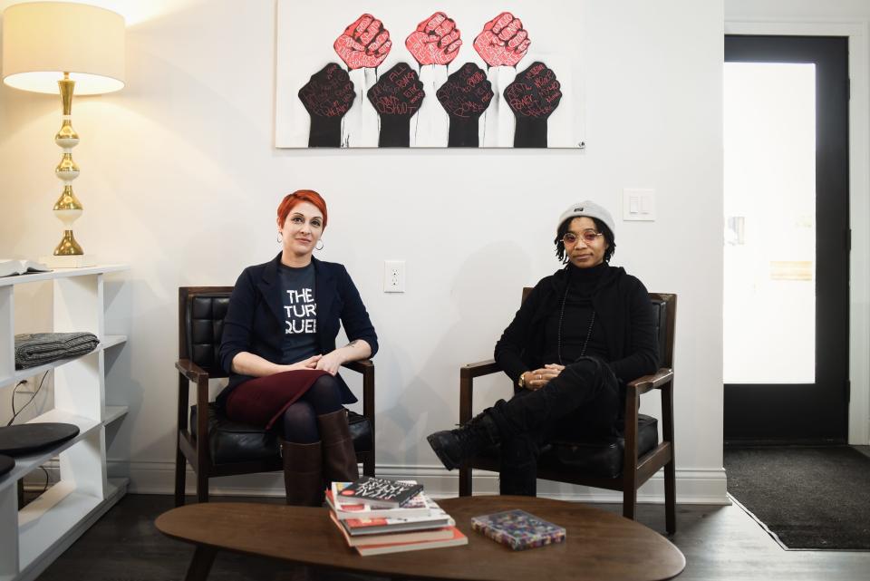 Activist Emily Dievendorf, left, and artist Fae Mitchell, right, of The Resistance bookstore in Lansing, pictured Thursday, Feb. 17, 2022, in their new brick-and-mortar located in the 500 block of West Ionia Street in Lansing. They aim to serve and unify underrepresented communities, and will showcase work by local artists, writers and activists within these communities.