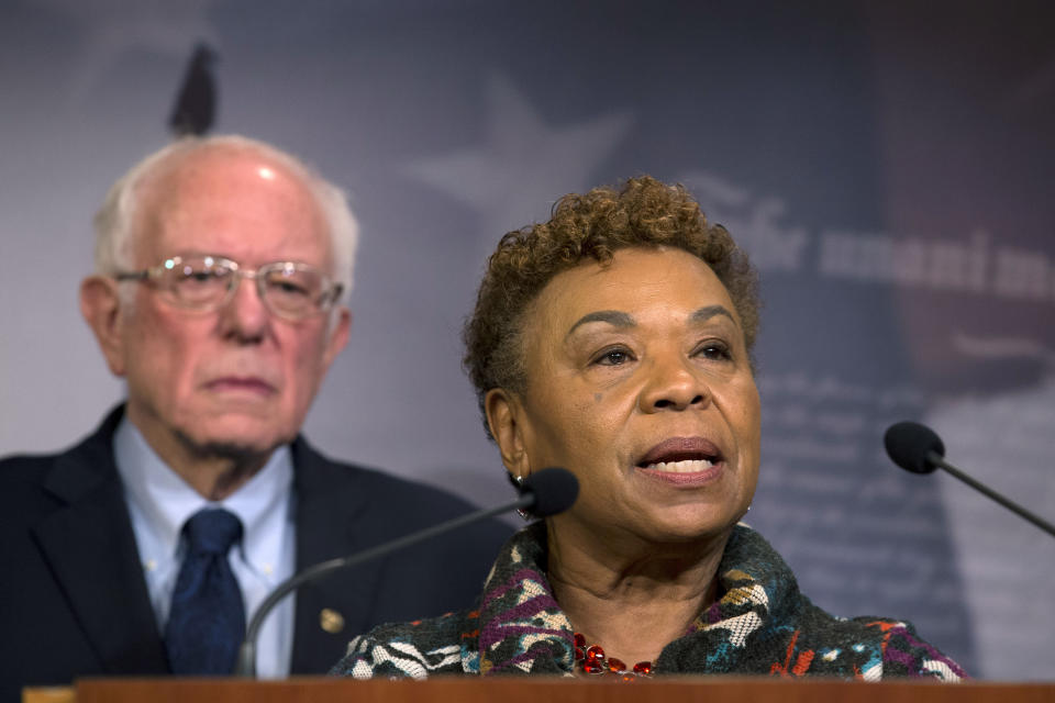 Rep. Barbara Lee, D-Calif., flanked by Sen. Bernie Sanders, I-Vt., speaks during a news conference on a measure limiting President Donald Trump's ability to take military action against Iran, on Capitol Hill, in Washington, Thursday, Jan. 9, 2020. (AP Photo/Jose Luis Magana)